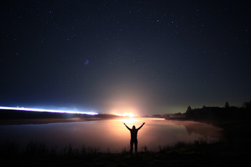 night man at Lake starry sky space alien