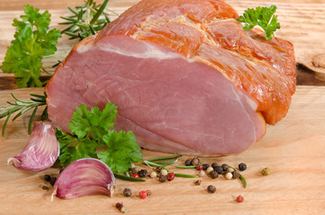 raw roast pork on wooden table
