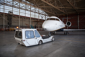 Business jet airplane stays in hangar.