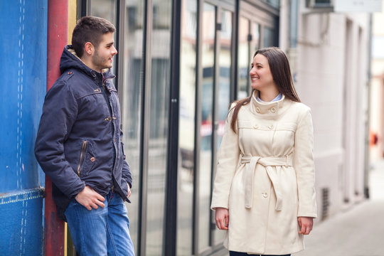 Young Man And Woman Meeting On The Street