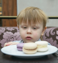 little boy eating cake