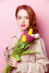 beautiful redhead girl with flowers
