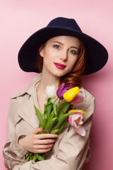 beautiful redhead girl with flowers