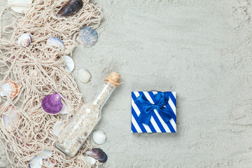 Net, shells with bottle and gift box