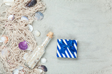 Net, shells with bottle and gift box
