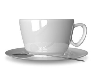White cup and spoon on saucer