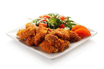 Fried chicken nuggets and vegetables