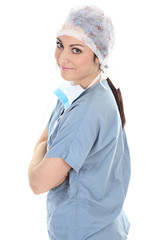 A surgeons , woman wearing protective uniforms,caps and masks an