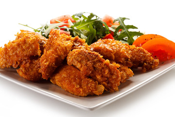 Fried chicken nuggets and vegetables