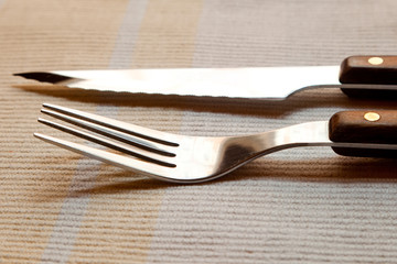 Fork, knife, napkin. With a retro effect and soft focus