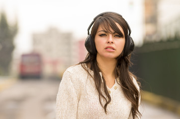 beautiful young girl walking in the streets af city