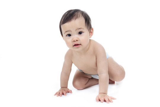 A Asian baby and family on a studio white background