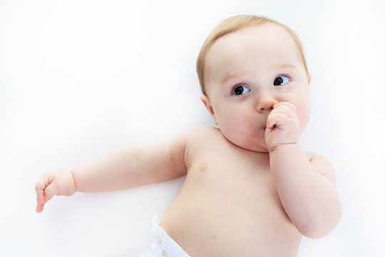 A sweet little boy in studio white background