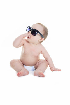 Portrait of cute toddler wearing sunglasses. Isolated on white.