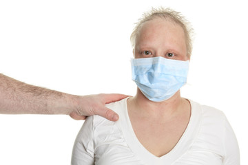 A chemotherapy woman wearing a medical mask.