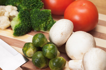 fresh food ingredients and knife on the breadboard