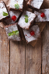 brownie cake close-up on paper. vertical top view