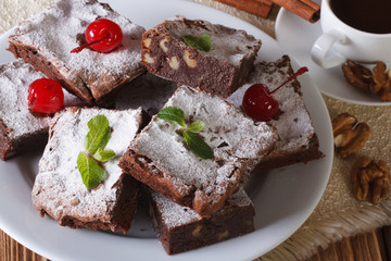 cake brownie with walnuts and coffee. Horizontal closeup