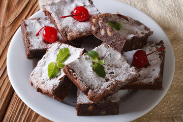 chocolate cake brownie with walnuts close-up. horizontal