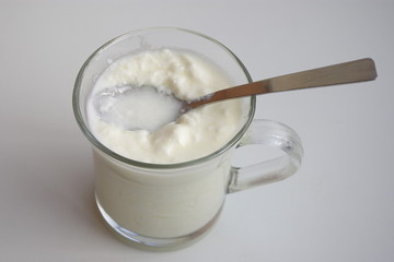 Cup of yogurt with spoon