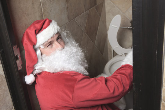 A santa claud sic in the bar toilet
