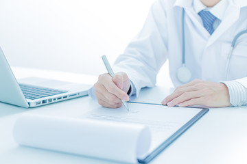 Close-up of a medical worker with laptop