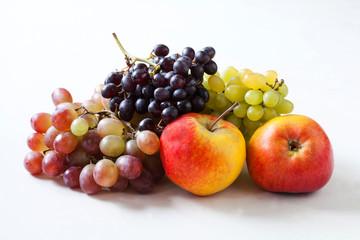 Naklejka na ściany i meble Apples and grapes on a white background