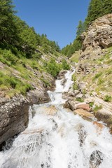 Mountain clean water flowing down a stream.