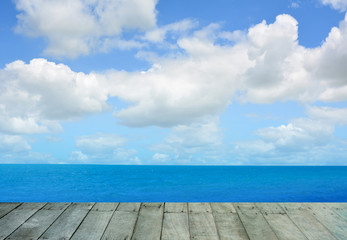 Obraz premium Wooden floor with sea background.