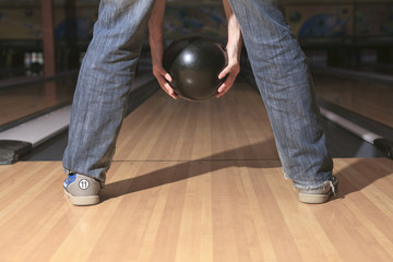 A bowling player in the alley