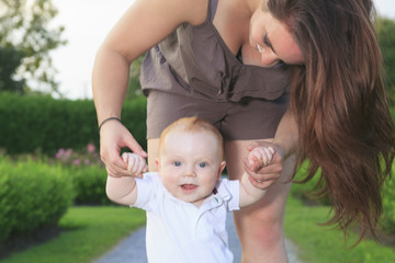 A mother with is baby on a beautiful forest
