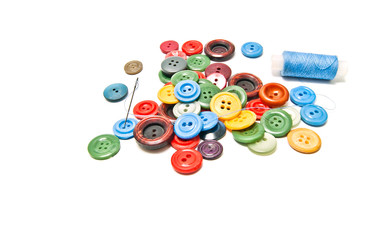 different buttons and spool of thread