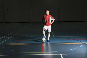 Obraz premium A female soccer player in a stadium