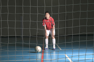 A female soccer player in a stadium