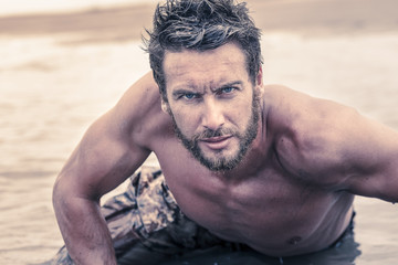 Close up Handsome Athletic Army with No Shirt Crawling at Sea Wa