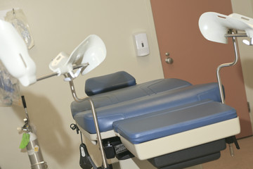 A Abortion chair in a hospital clinic interior