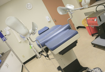A Abortion chair in a hospital clinic interior