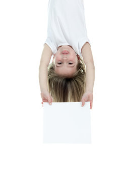 A children girl holding a white card over a white background.