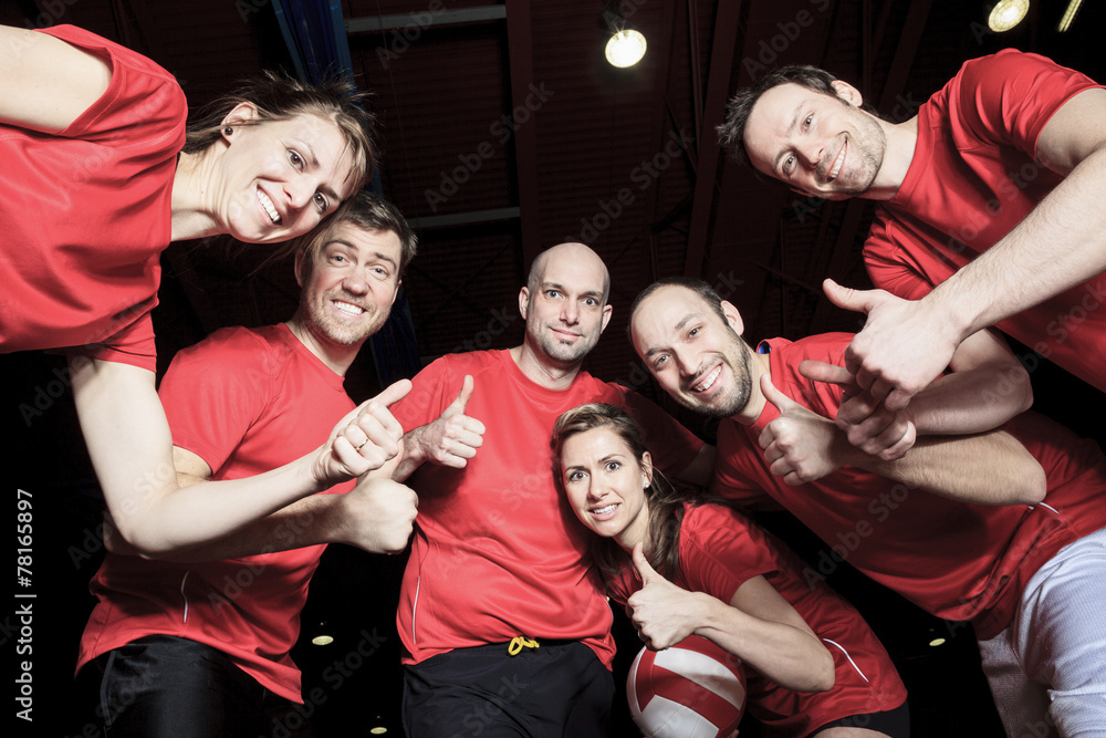 Wall mural A big team of volleyball wearing in red