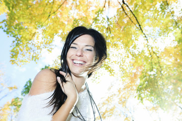 A beautiful autumn woman having good time.