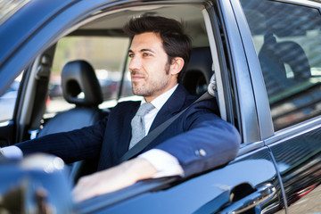 Handsome man driving his car