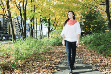 A beautiful autumn woman having good time.