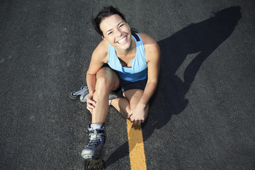 A woman with is rollerblade in summer time - obrazy, fototapety, plakaty