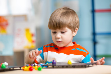 kid playing with educational toys