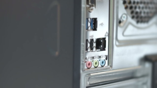 Man plug and unplug Lan Network cable in desktop PC