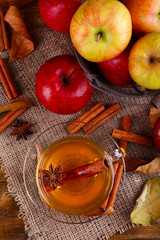 Composition of  apple cider with cinnamon sticks, fresh apples