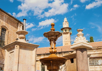 Fountain and  minaret in Square Muristan in Jerusalem