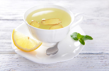 Ginger tea with lemon on table close-up