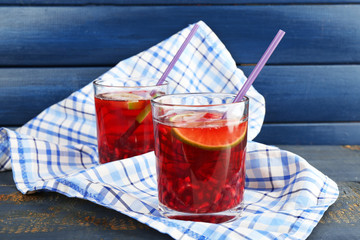 Pomegranate drink in glasses with slices of lime