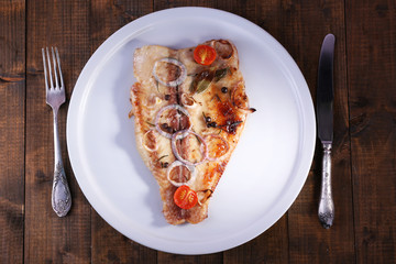 Dish of Pangasius fillet with spices and vegetables